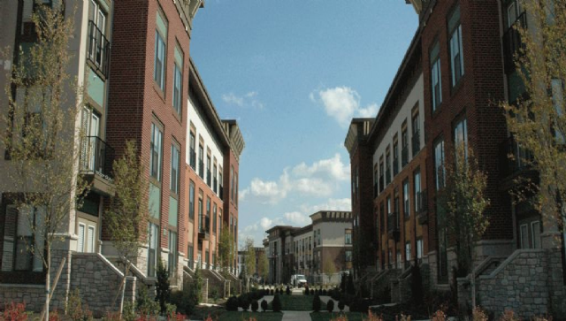 image of a neighborhood with apartment buildings on each side